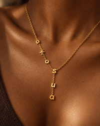 Akosua name necklace on a model