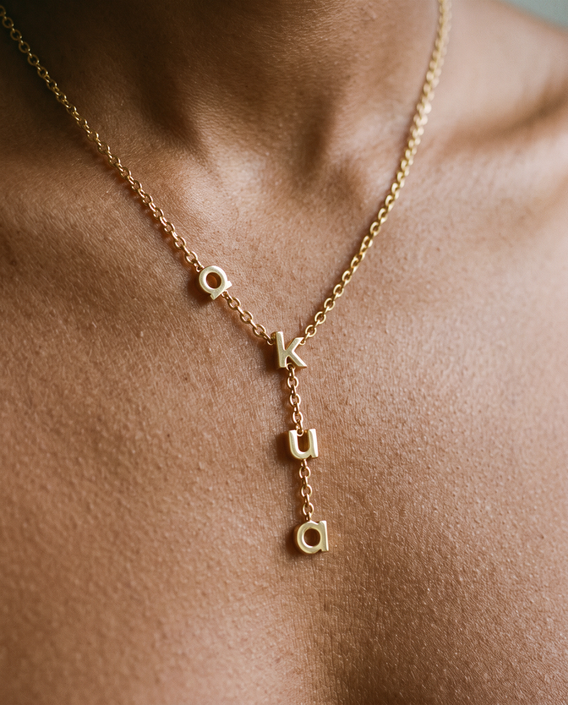 Akua name necklace on a model