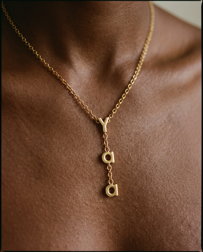 Yaa name necklace on a model