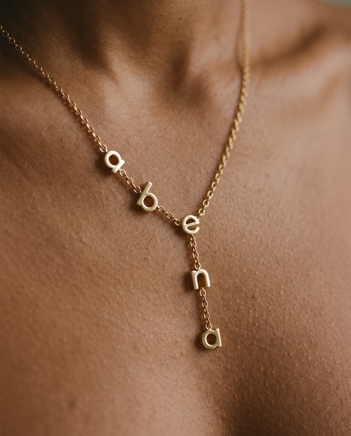 Abena name necklace on a model