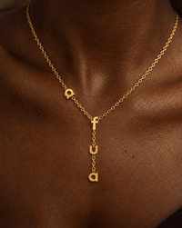 Afua name necklace on a model