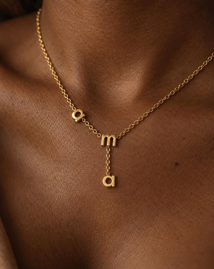 Ama name necklace on a model